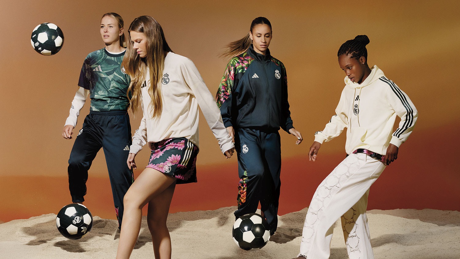 Jogadoras do Real Madrid jogam altinha na areia com peças florais, jaqueta escura e moletom creme da coleção